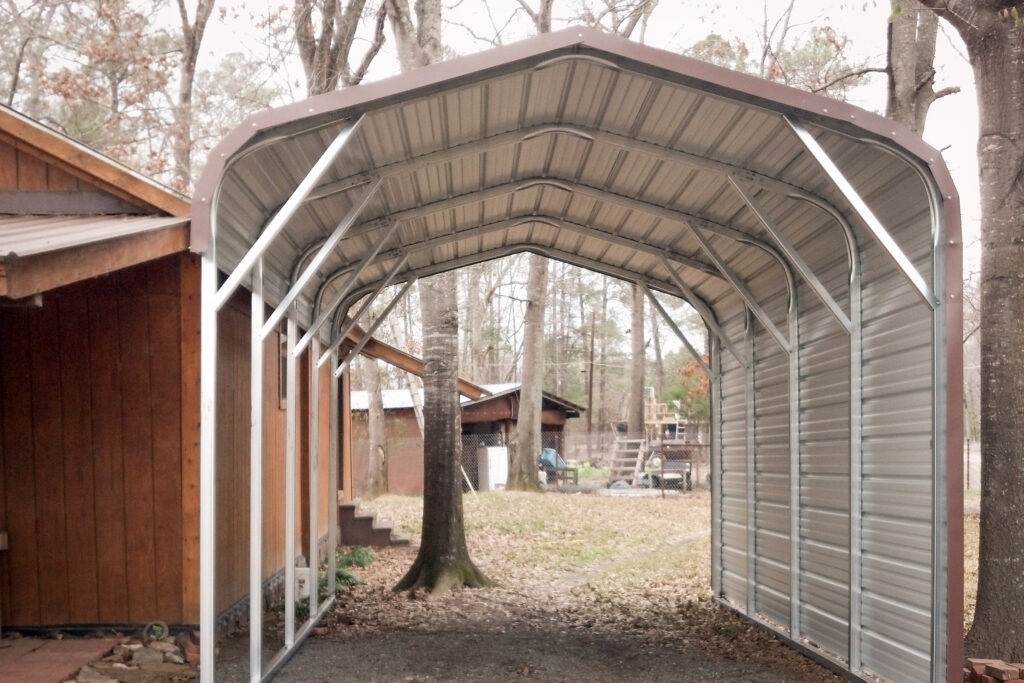 Carport over driveway in the woods